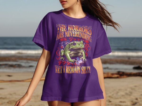 65c1ed00-c016-42cd-a260-26d624d2126c Cosmic Frog T-Shirt, The Horrors Are Neverending Yet I Remain Silly, Funny Dark Humor Eldritch Weirdcore Meme Tee